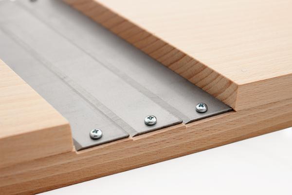 Detail of the Cabbage Shredder blade assembly showing steel blades secured to beechwood with screws.