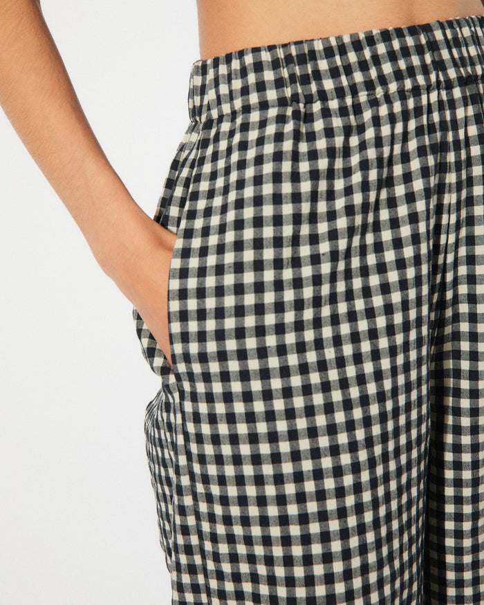 Black gingham checkered cep pants by Rita Row with an elastic high waist at Clad, a sustainable clothing boutique in Asheville, NC