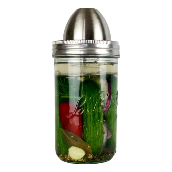 ChouAmi Solo stainless steel fermentation device installed on a Le Parfait Familia Wiss jar fermenting cucumbers, garlic, bay leaf, and chili.