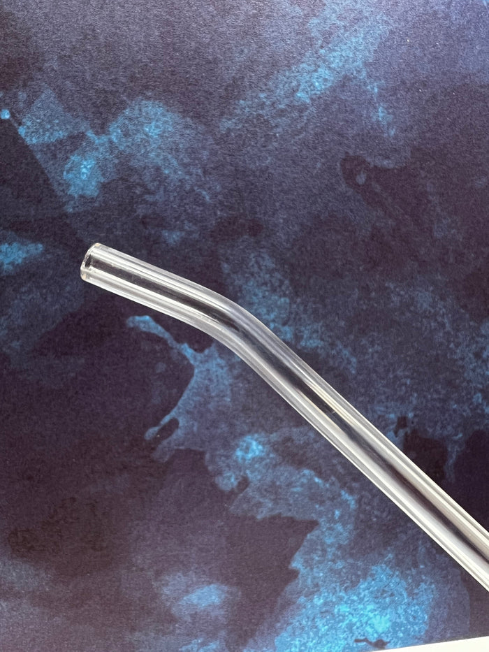 Curved Le Parfait glass drinking straw on a deep blue watercolor background.