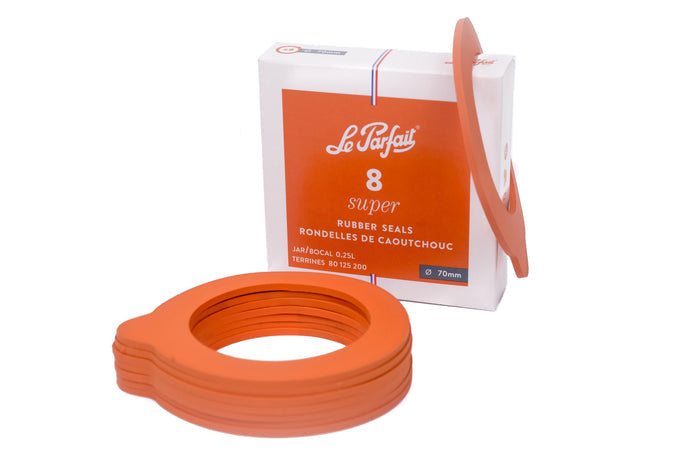 A stack of orange Le Parfait rubber gaskets.