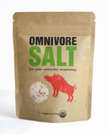Jar filled with organic omnivore seasoning blend on counter.